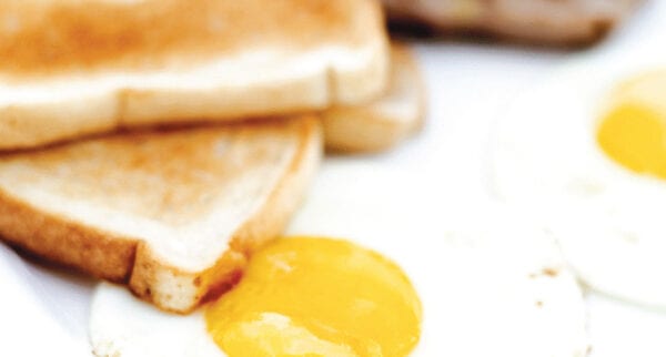 A close up of an egg on toast